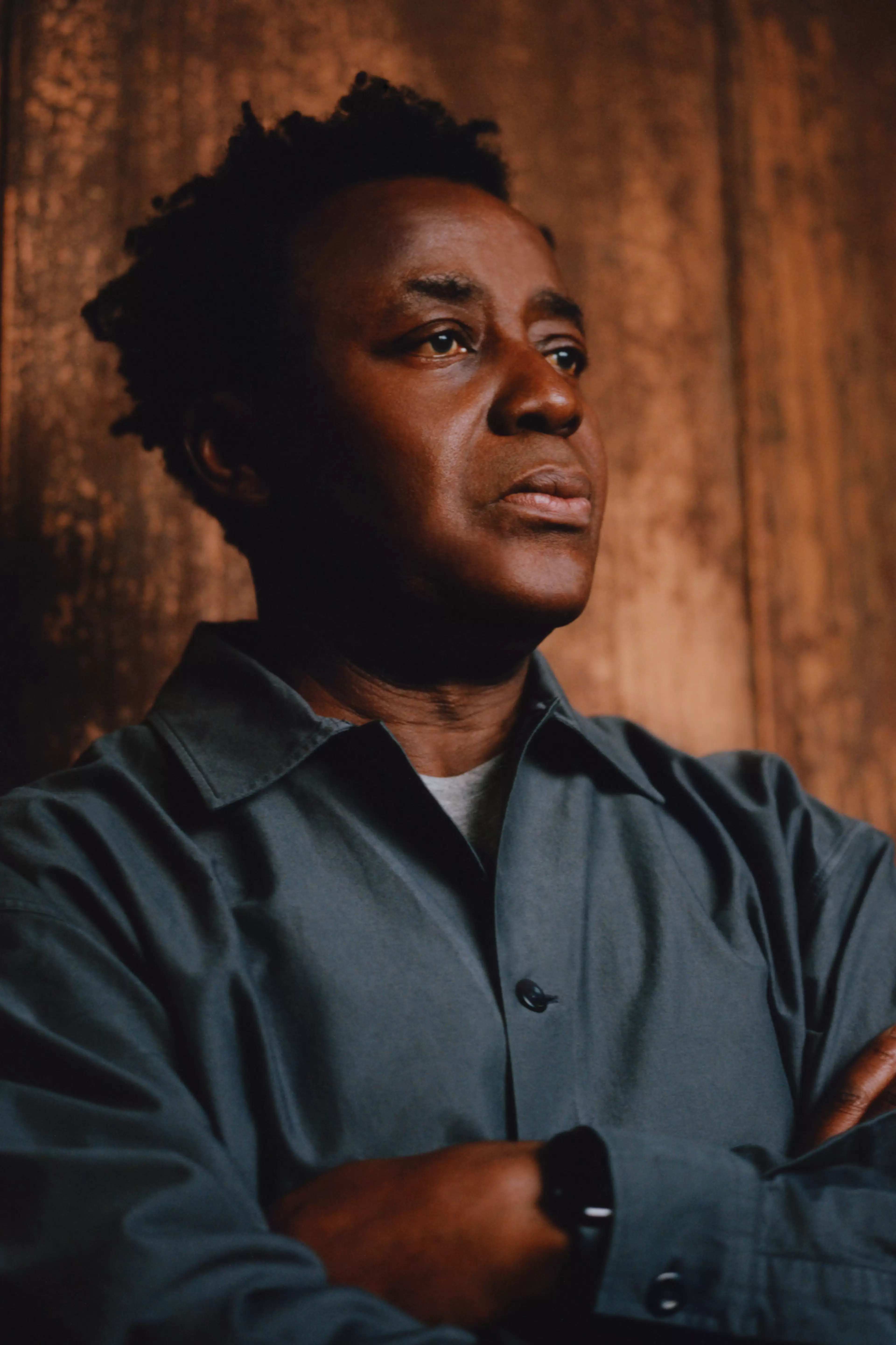 Portrait of Sir John Akomfrah, British artist and filmmaker, photography by Christian Cassiel
